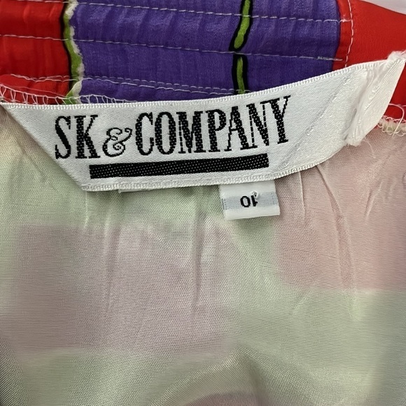 SK & Company silky, wild patterned skirt. Size 10. Fully lined and zipper back. - Picture 9 of 9